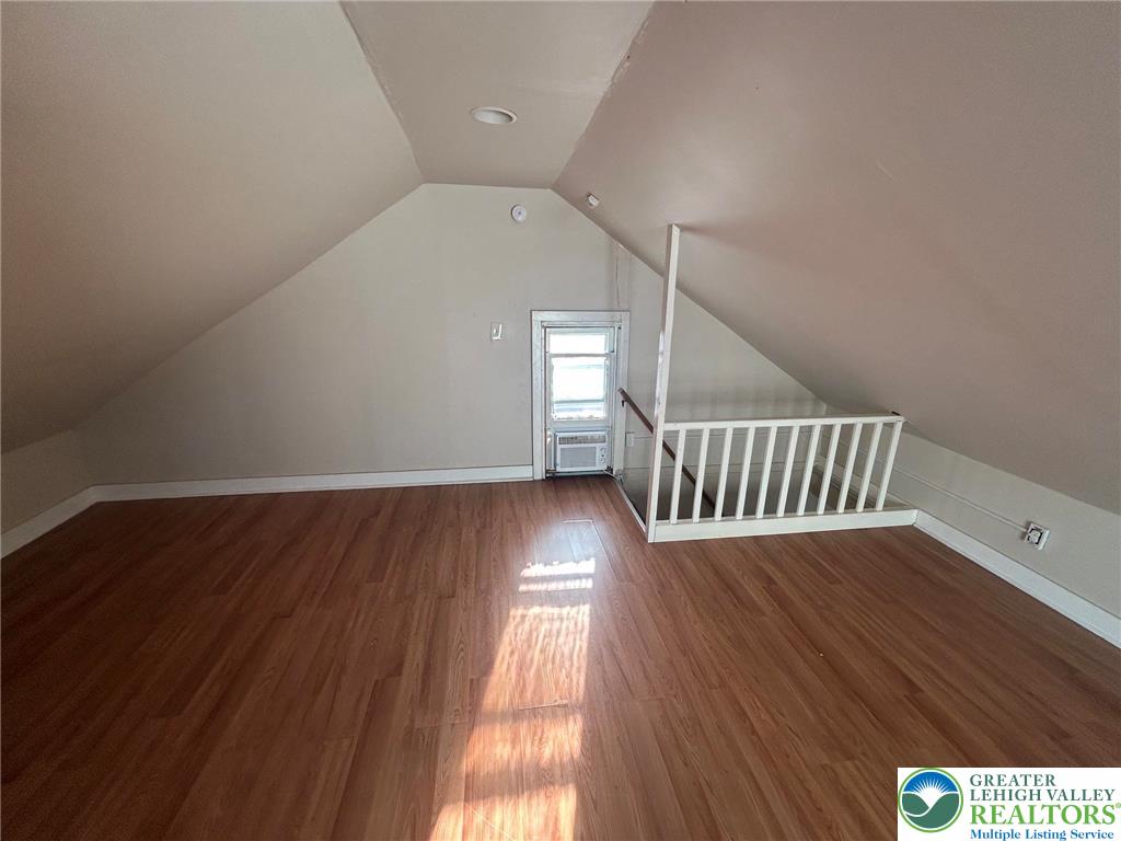 1122 East 4th Street Bethlehem, PA 18015 - Photo 13 of 13 A versatile attic space features rich hardwood flooring and a bright window for ample light.