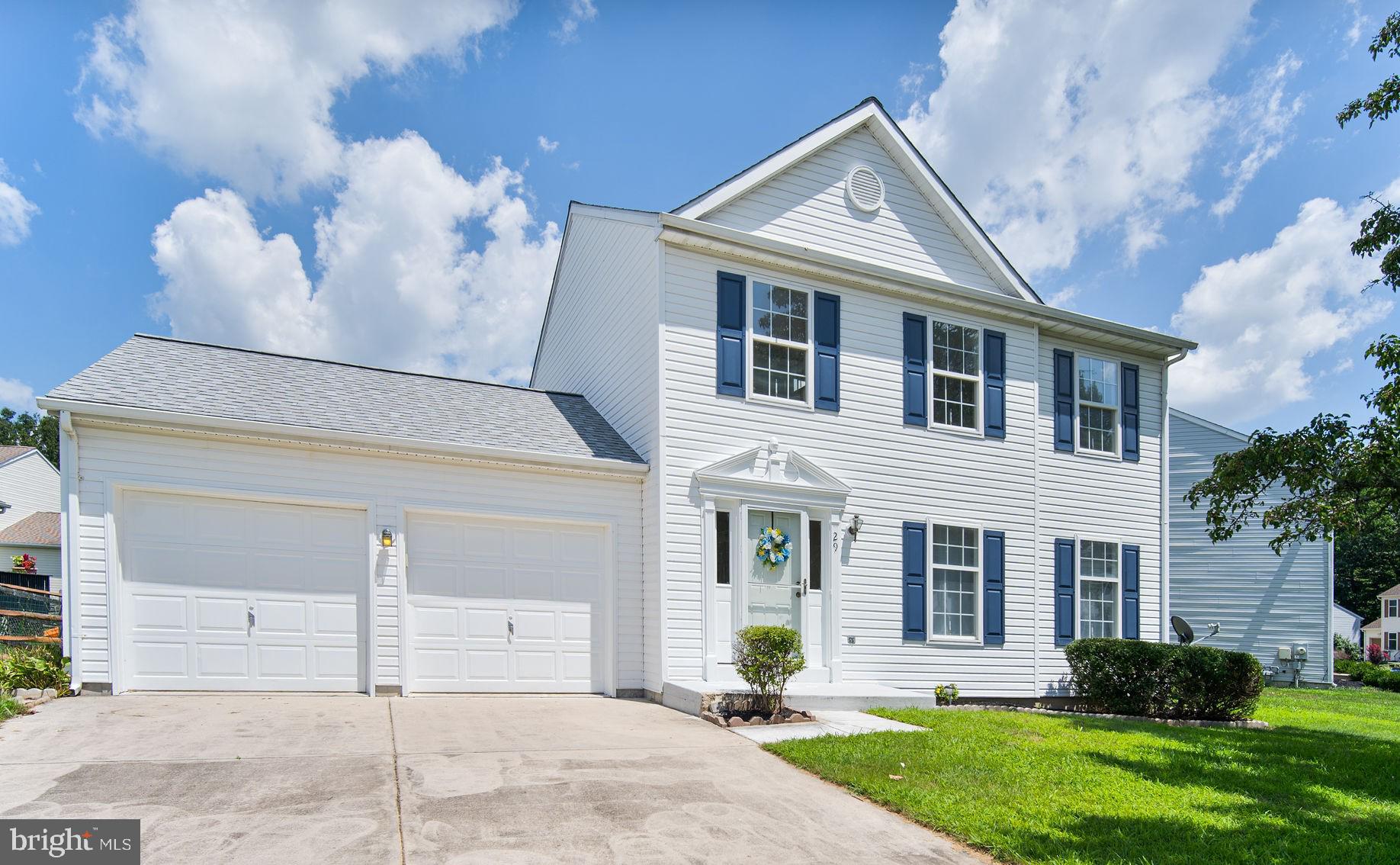 29 Bastille Loop Newark, DE 19702 - Photo 1 of 34 a front view of a house with a yard and garage