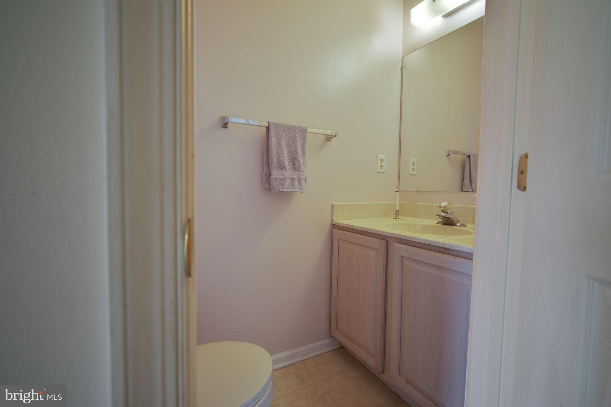 29 Bastille Loop Newark, DE 19702 - Photo 13 of 34 a bathroom with a granite countertop sink and a mirror