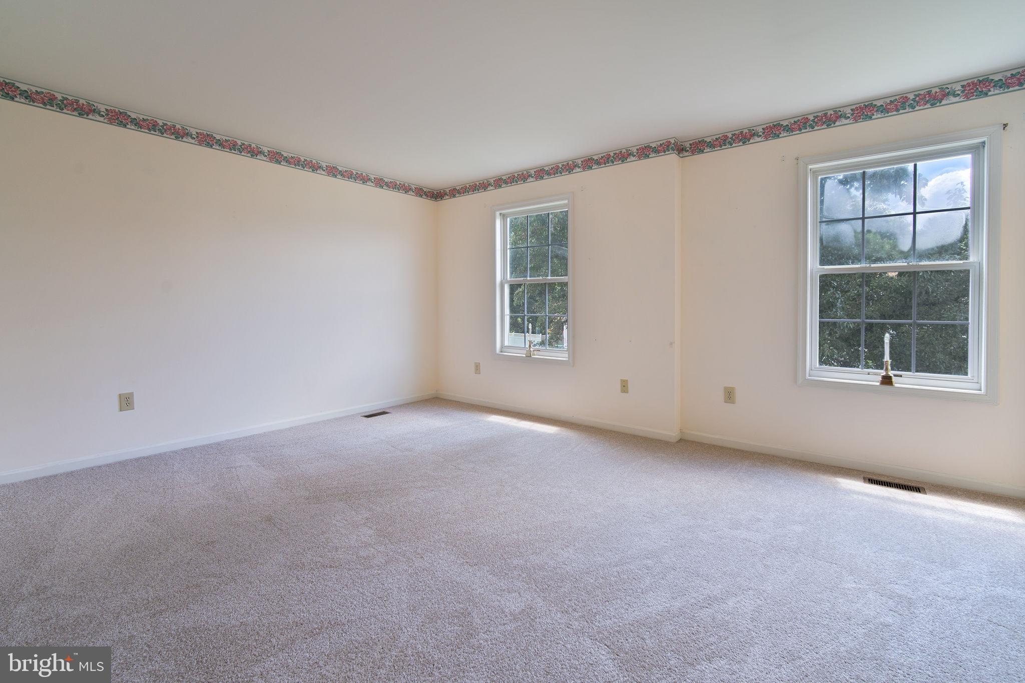 29 Bastille Loop Newark, DE 19702 - Photo 15 of 34 a view of a big room with windows and chandelier fan