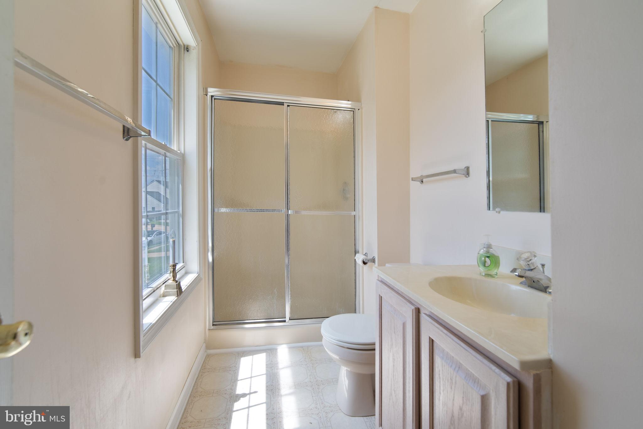 29 Bastille Loop Newark, DE 19702 - Photo 17 of 34 a bathroom with a sink a toilet and shower