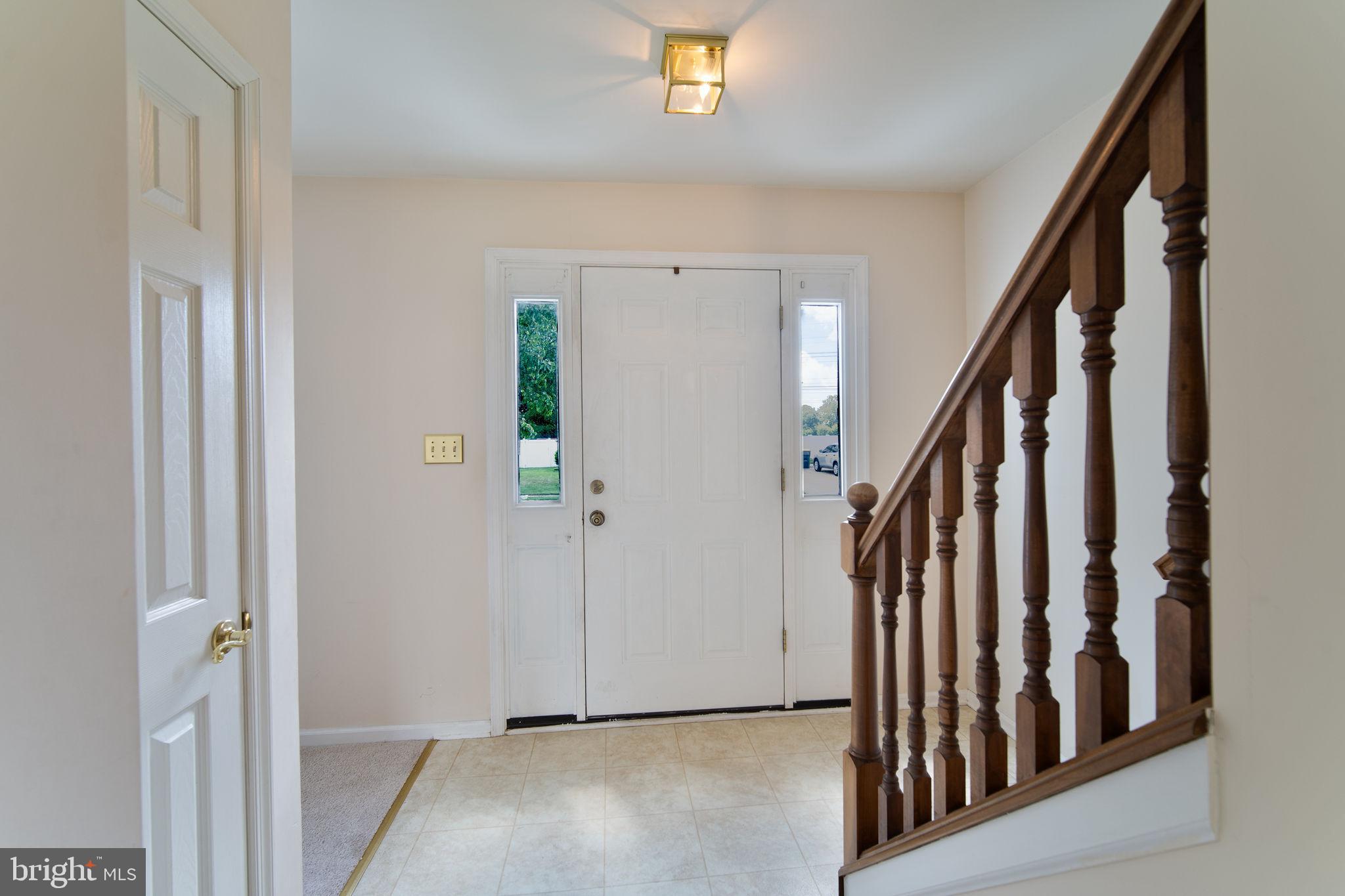 29 Bastille Loop Newark, DE 19702 - Photo 2 of 34 a view of a hallway with wooden floor and entryway