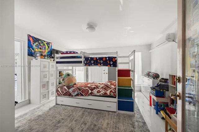 a bedroom with bed and a large closet