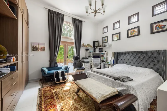 a living room with furniture a large window and a flat screen tv