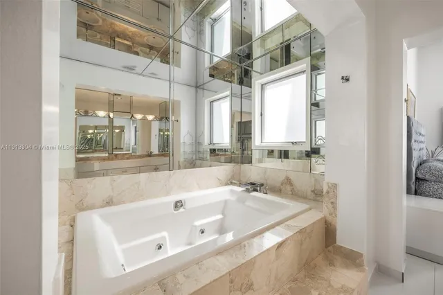 a bathroom with a bathtub and a sink