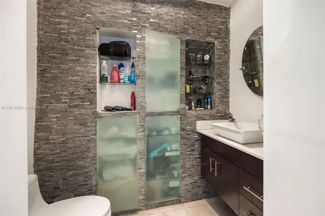 a bathroom with a sink and mirror