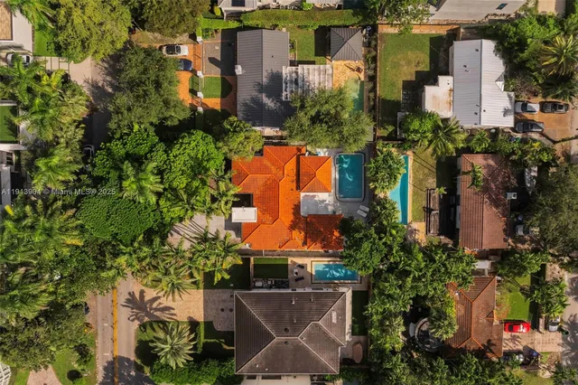 an aerial view of a house with a yard and garden
