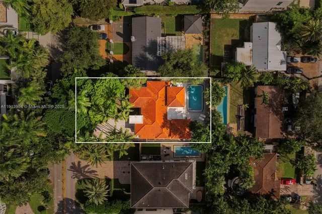 an outdoor view of the house and swimming pool