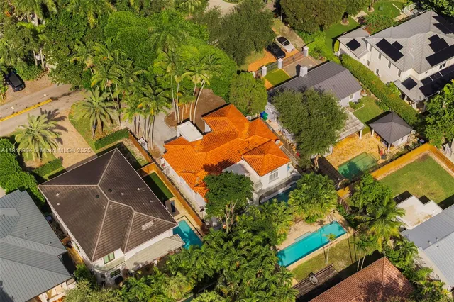 an aerial view of residential house with outdoor space and parking