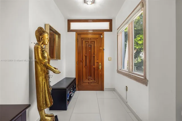 a view of hallway with washer and dryer