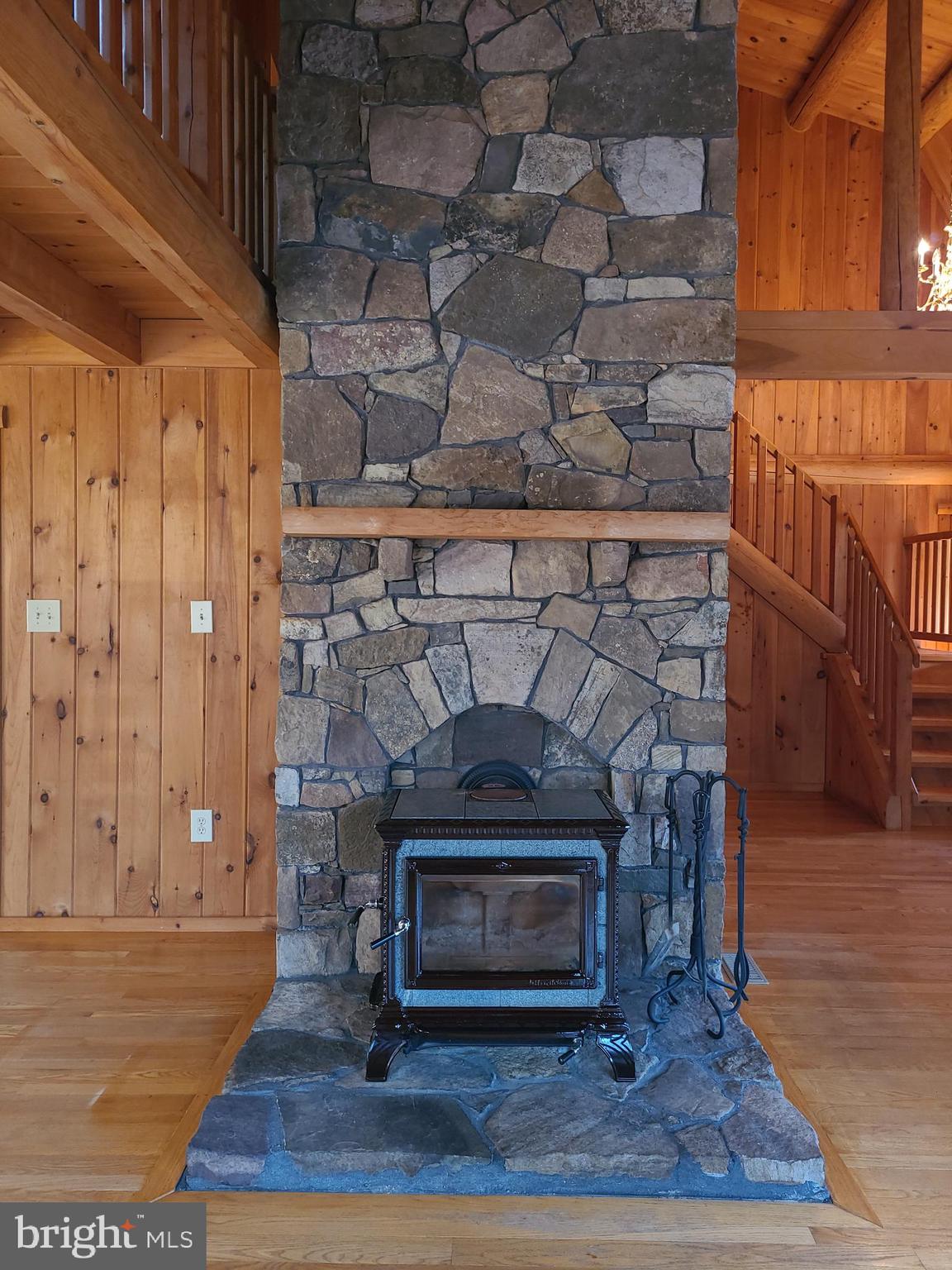 1537 Hidden Valley Road Franklin, WV 26807 - Photo 23 of 78 a view of fireplace and wooden floor