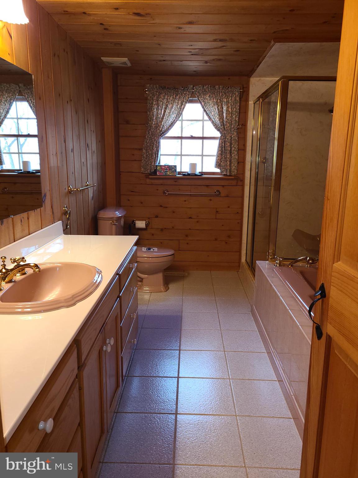 1537 Hidden Valley Road Franklin, WV 26807 - Photo 29 of 78 a bathroom with a sink a vanity and a mirror