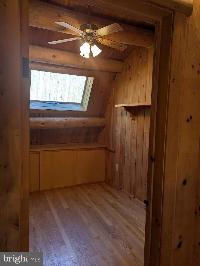 1537 Hidden Valley Road Franklin, WV 26807 - Photo 35 of 78 a view of empty room with wooden floor and fan