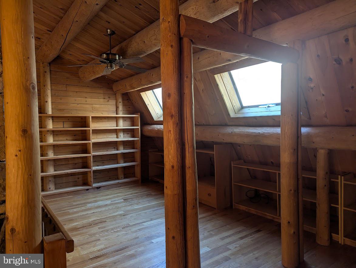 1537 Hidden Valley Road Franklin, WV 26807 - Photo 36 of 78 a view of an empty room with wooden floor and a window