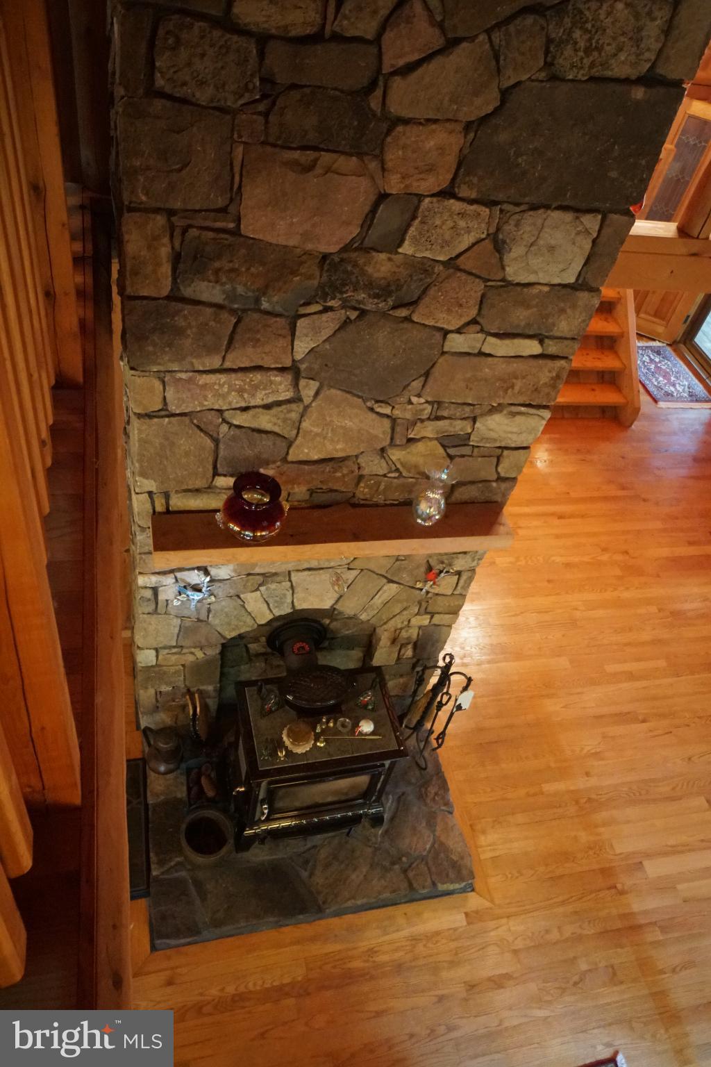 1537 Hidden Valley Road Franklin, WV 26807 - Photo 38 of 78 a room with water heater and wooden cabinets