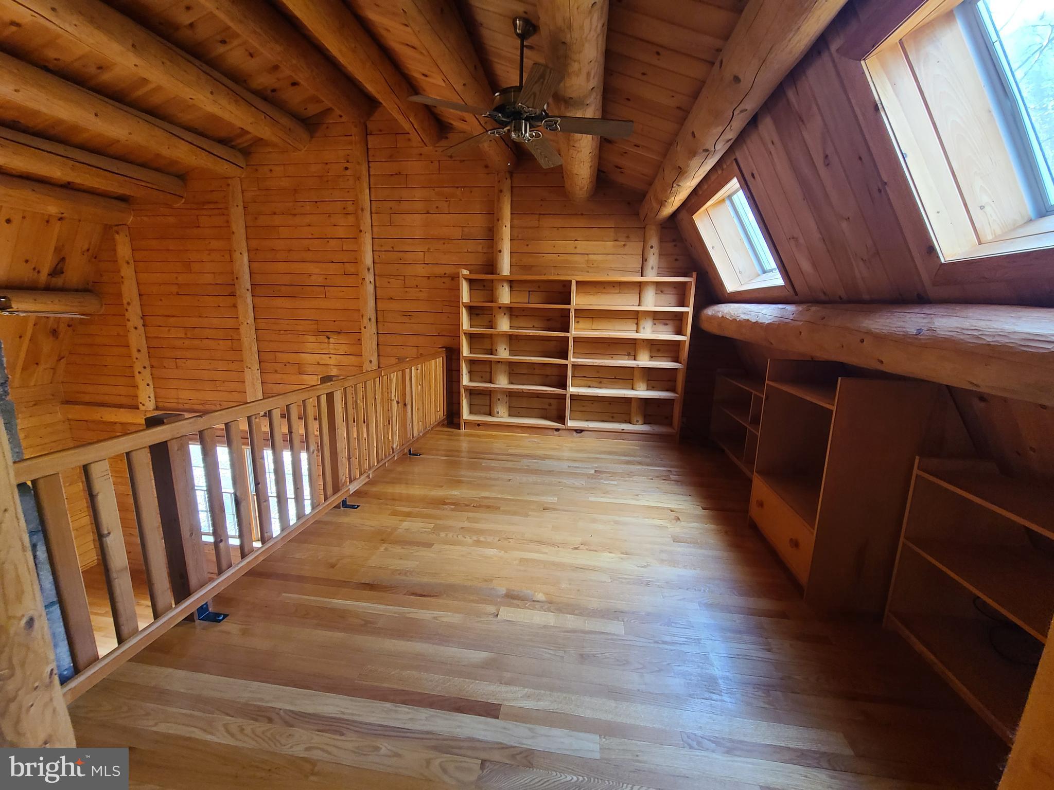 1537 Hidden Valley Road Franklin, WV 26807 - Photo 47 of 78 a view of an empty room with wooden floor