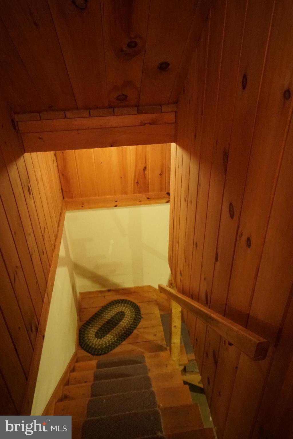 1537 Hidden Valley Road Franklin, WV 26807 - Photo 49 of 78 Warm wooden staircase leading to cozy retreat.