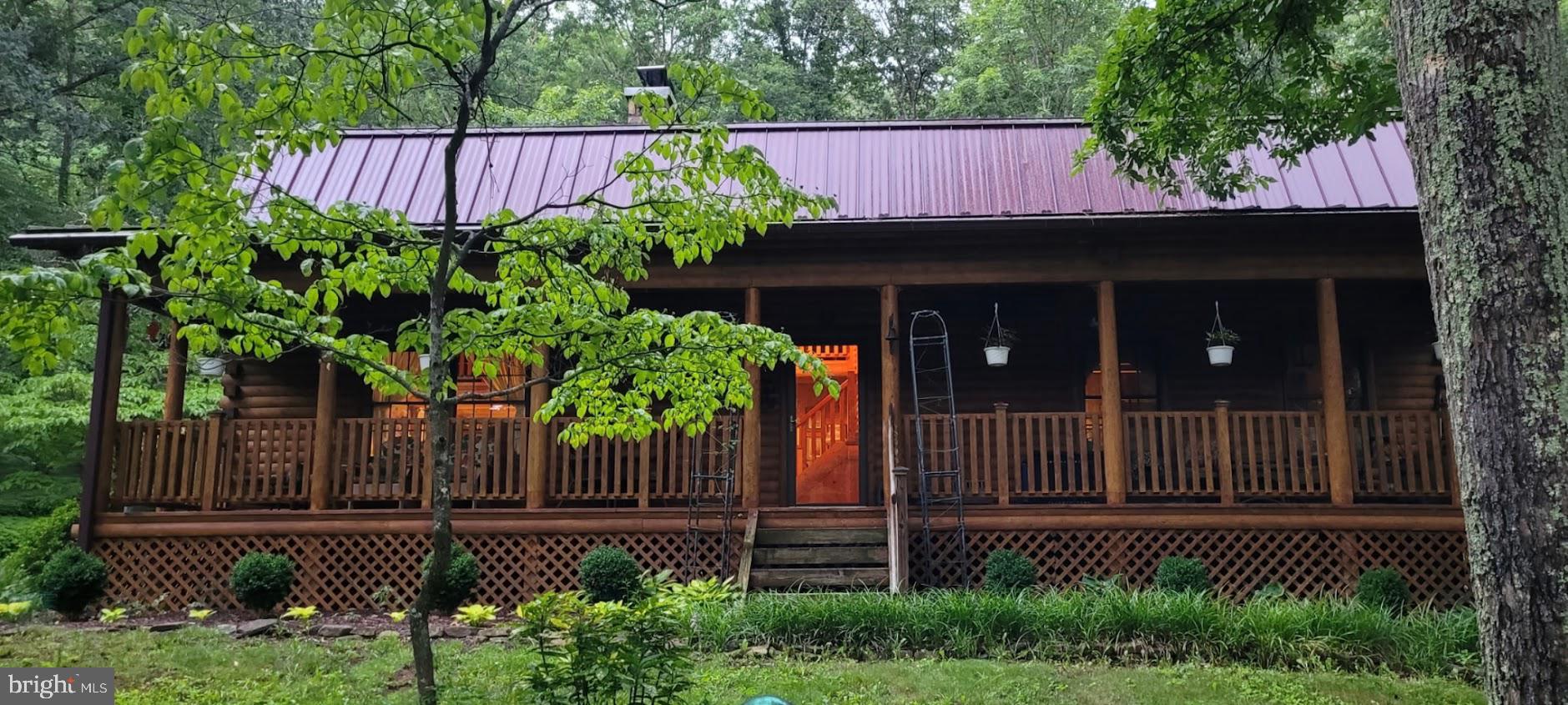 1537 Hidden Valley Road Franklin, WV 26807 - Photo 8 of 78 a front view of a house with a garden