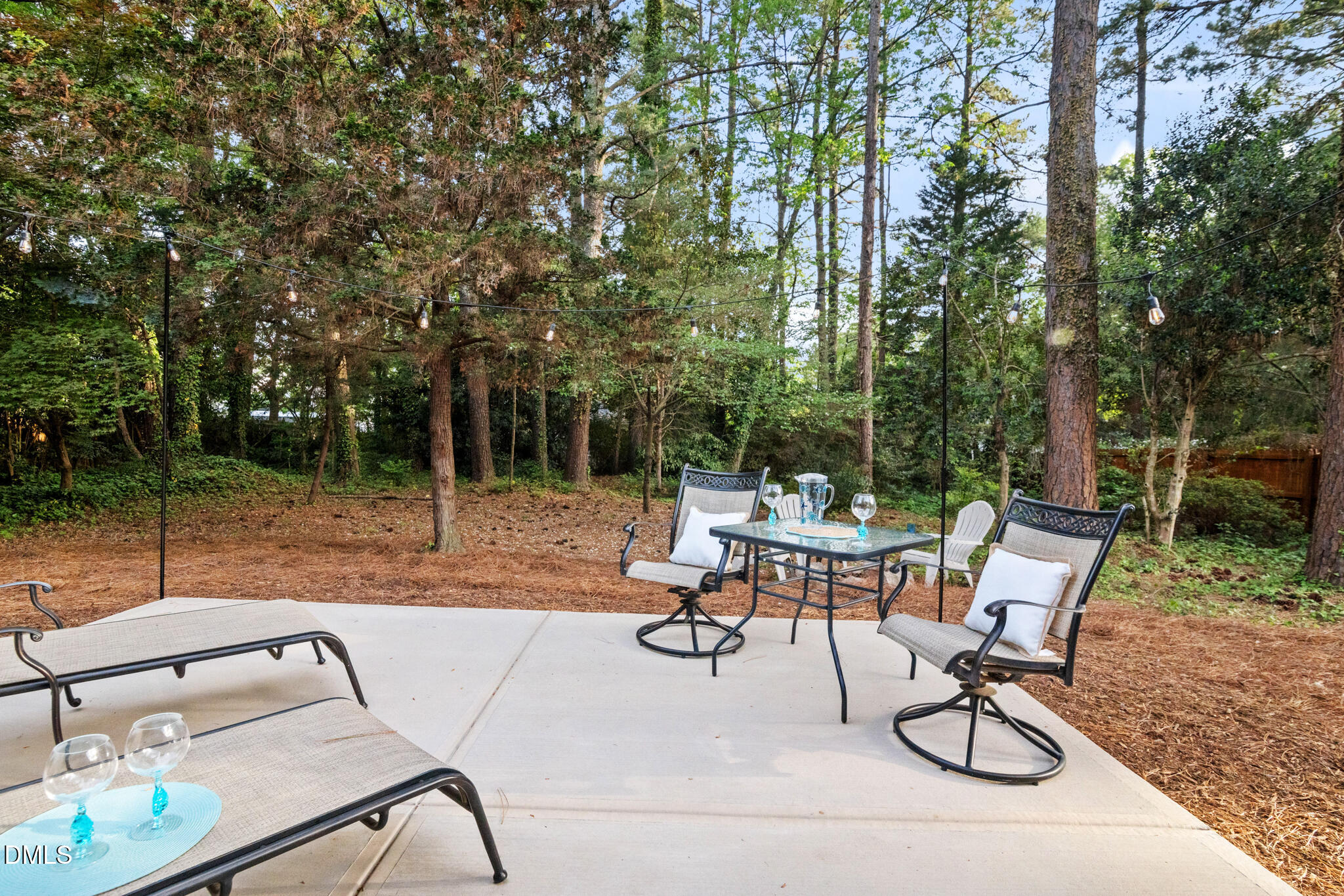 3509 Morningside Drive Raleigh, NC 27607 - Photo 41 of 49 a view of a patio with a table and chairs