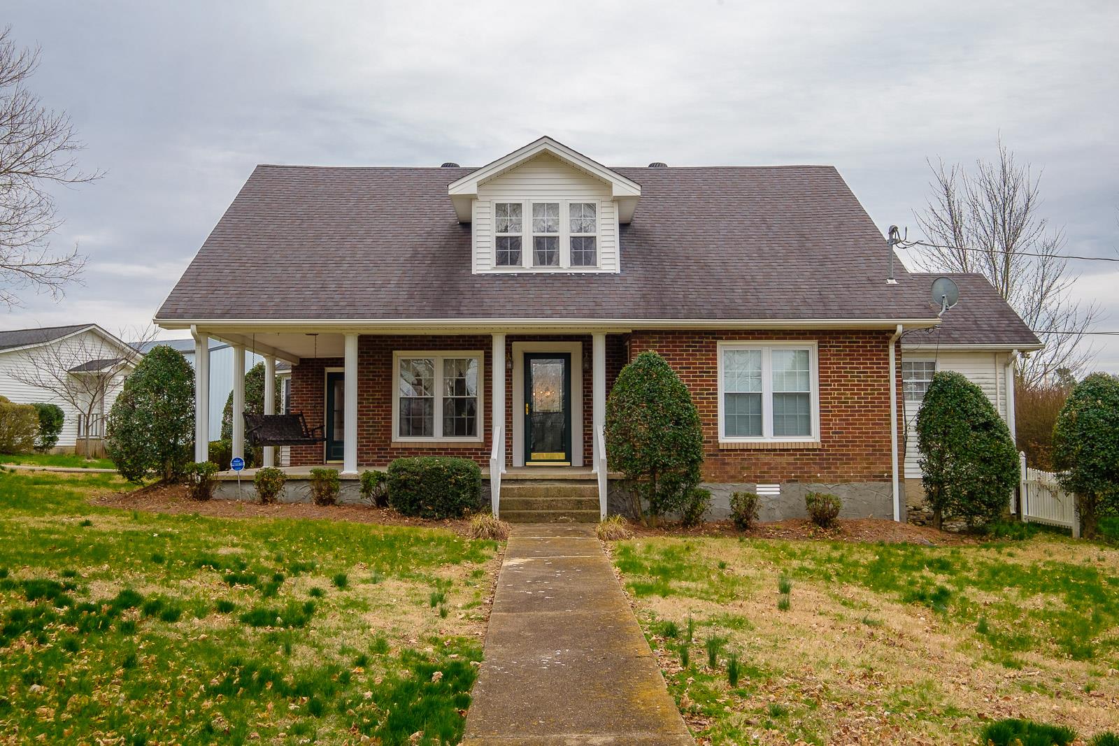 900 Red Boiling Springs Road Lafayette, TN 37083 - Photo 1 of 30 front view of a brick house with a yard