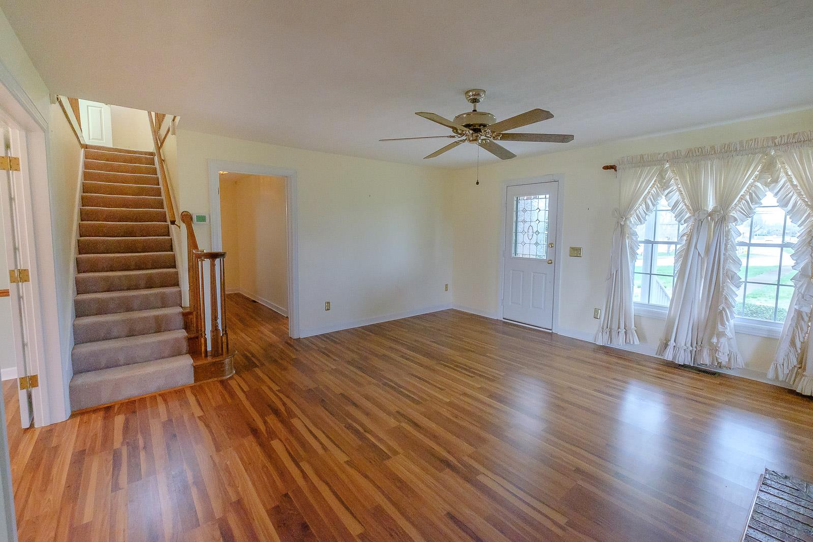900 Red Boiling Springs Road Lafayette, TN 37083 - Photo 12 of 30 wooden floor in an empty room with a window