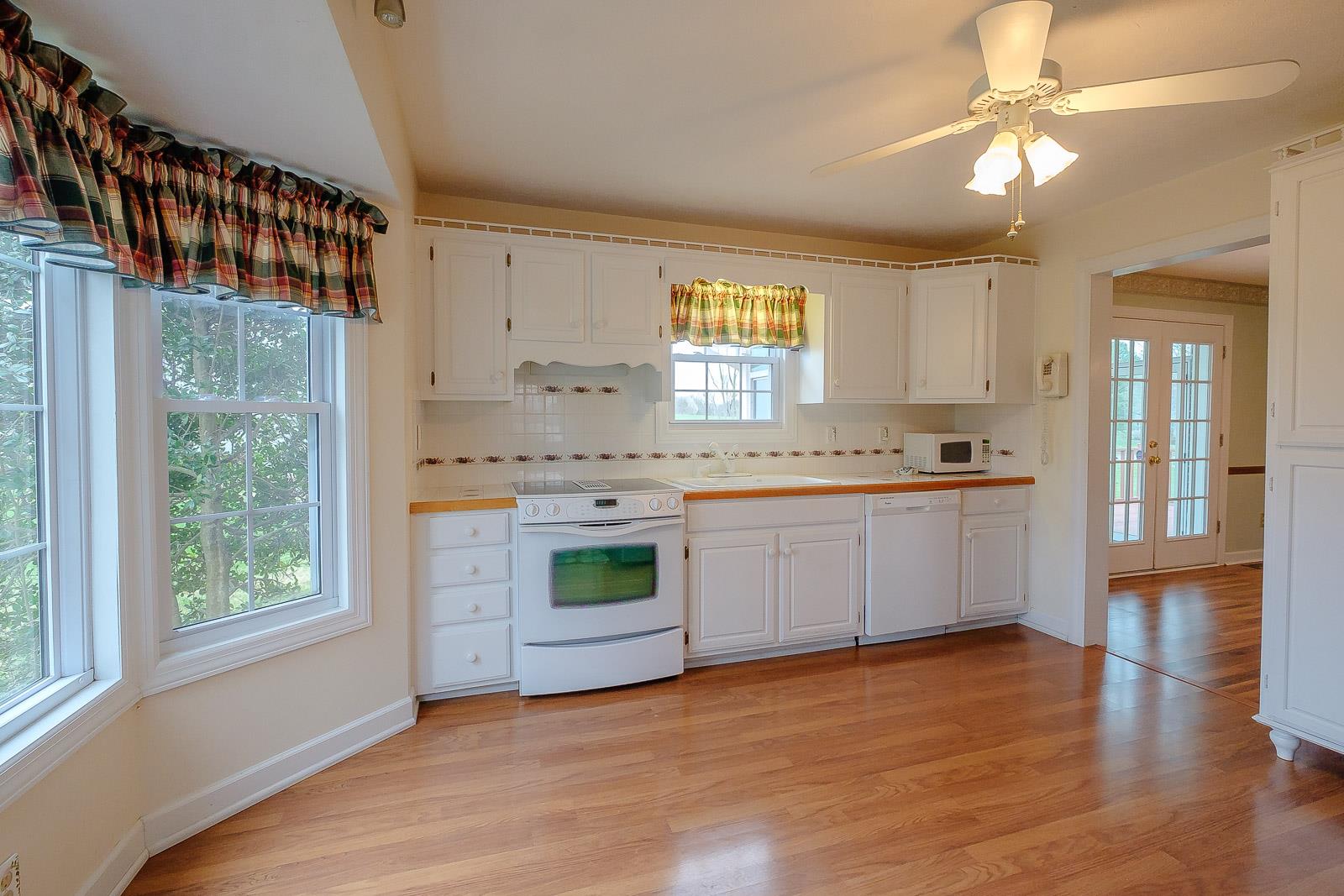 900 Red Boiling Springs Road Lafayette, TN 37083 - Photo 13 of 30 a kitchen with a white cabinets and window