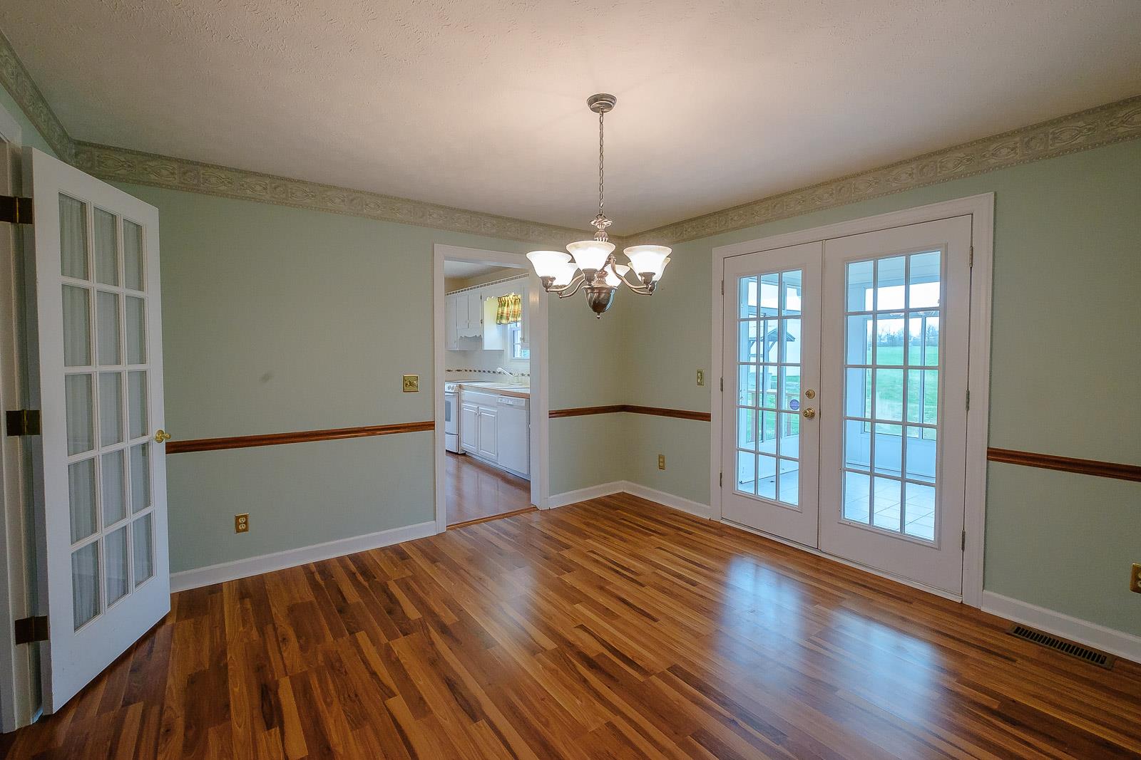 900 Red Boiling Springs Road Lafayette, TN 37083 - Photo 18 of 30 a view of empty room with wooden floor and fan