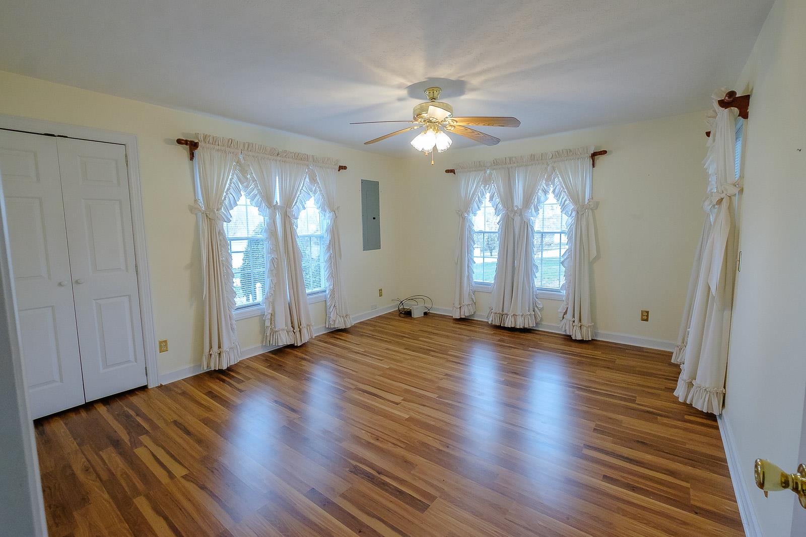 900 Red Boiling Springs Road Lafayette, TN 37083 - Photo 22 of 30 a view of an empty room with window and wooden floor