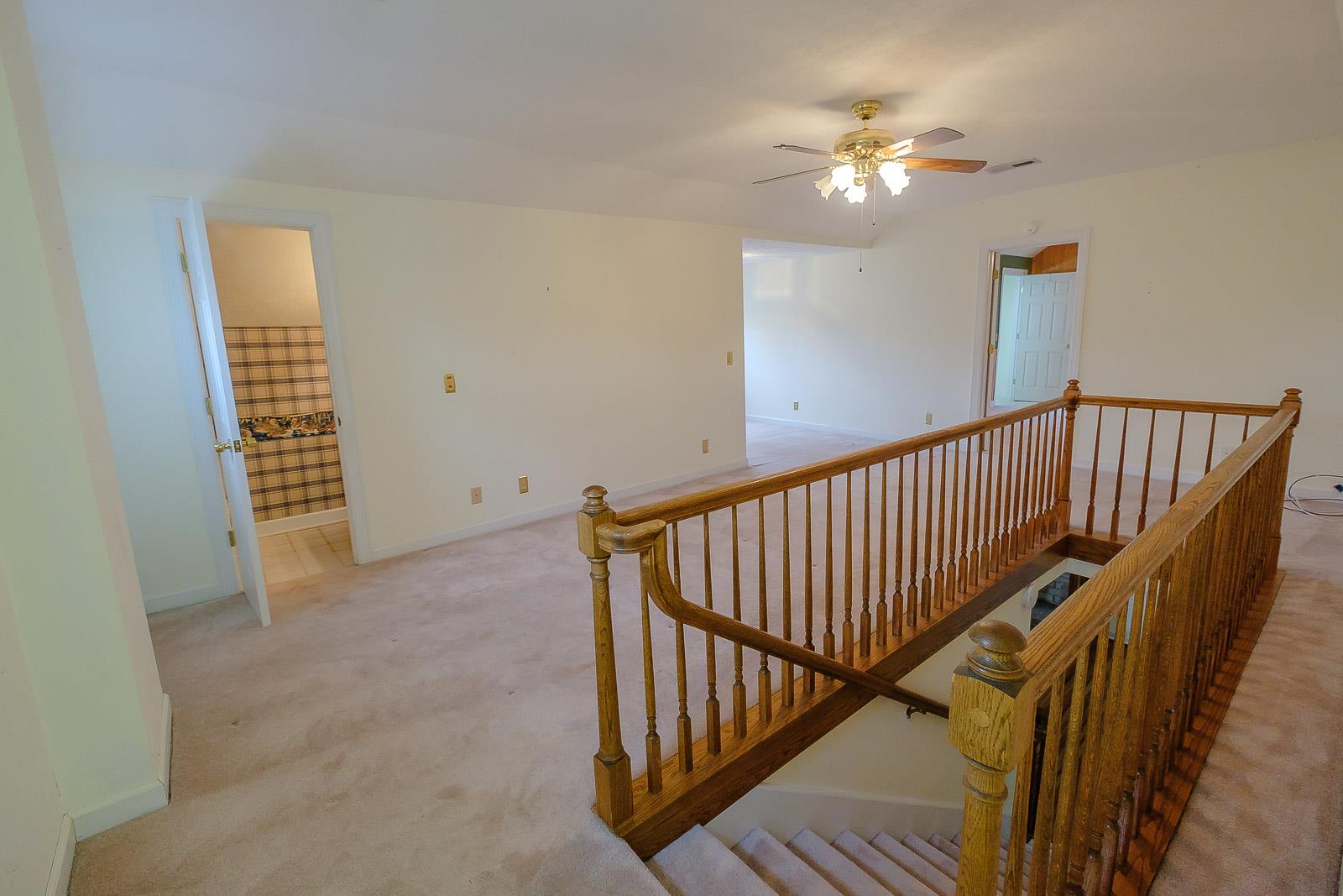 900 Red Boiling Springs Road Lafayette, TN 37083 - Photo 26 of 30 a view of staircase with railing and a chandelier