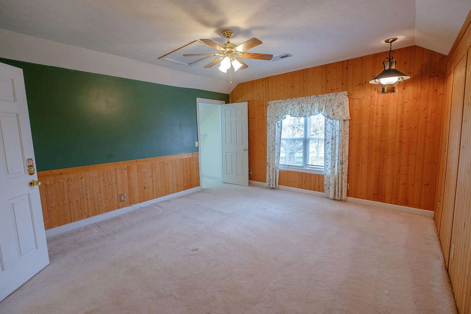 900 Red Boiling Springs Road Lafayette, TN 37083 - Photo 29 of 30 a view of a livingroom with a chandelier fan and a window
