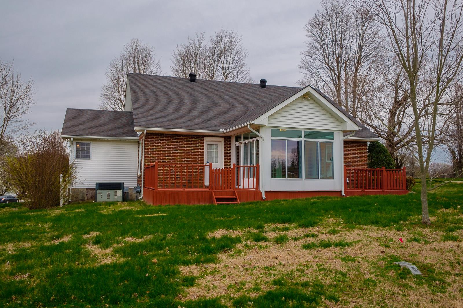 900 Red Boiling Springs Road Lafayette, TN 37083 - Photo 5 of 30 a front view of a house with a yard and trees