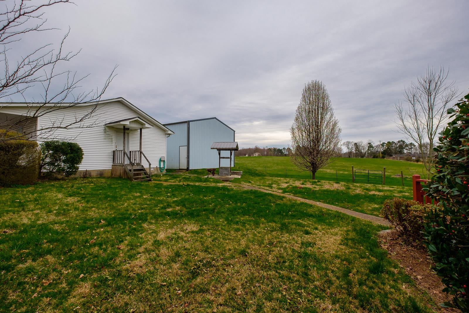 900 Red Boiling Springs Road Lafayette, TN 37083 - Photo 8 of 30 a house view with a garden space