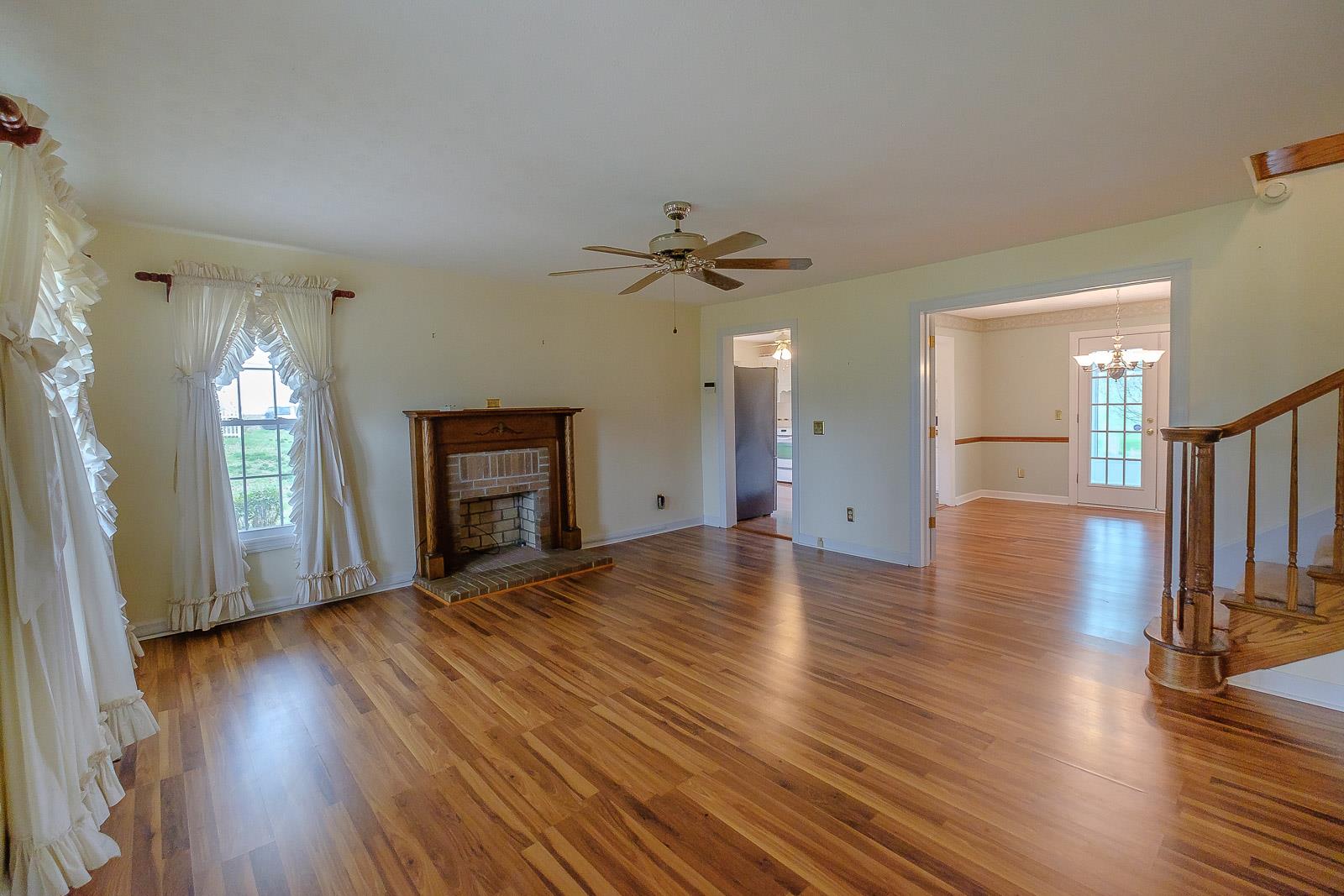 900 Red Boiling Springs Road Lafayette, TN 37083 - Photo 10 of 30 a view of an empty room with wooden floor and a window