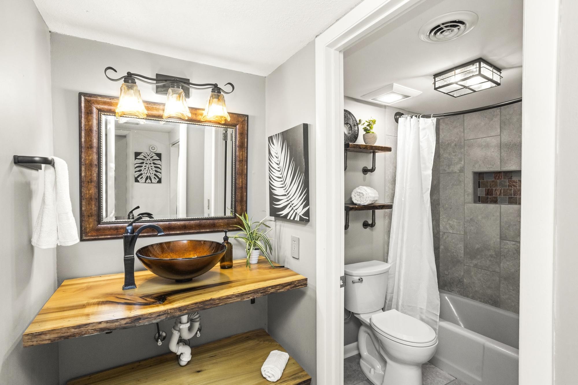 21 Vaughns Gap Road, Unit 16 Nashville, TN 37205 - Photo 14 of 34 a bathroom with a sink a toilet and shower