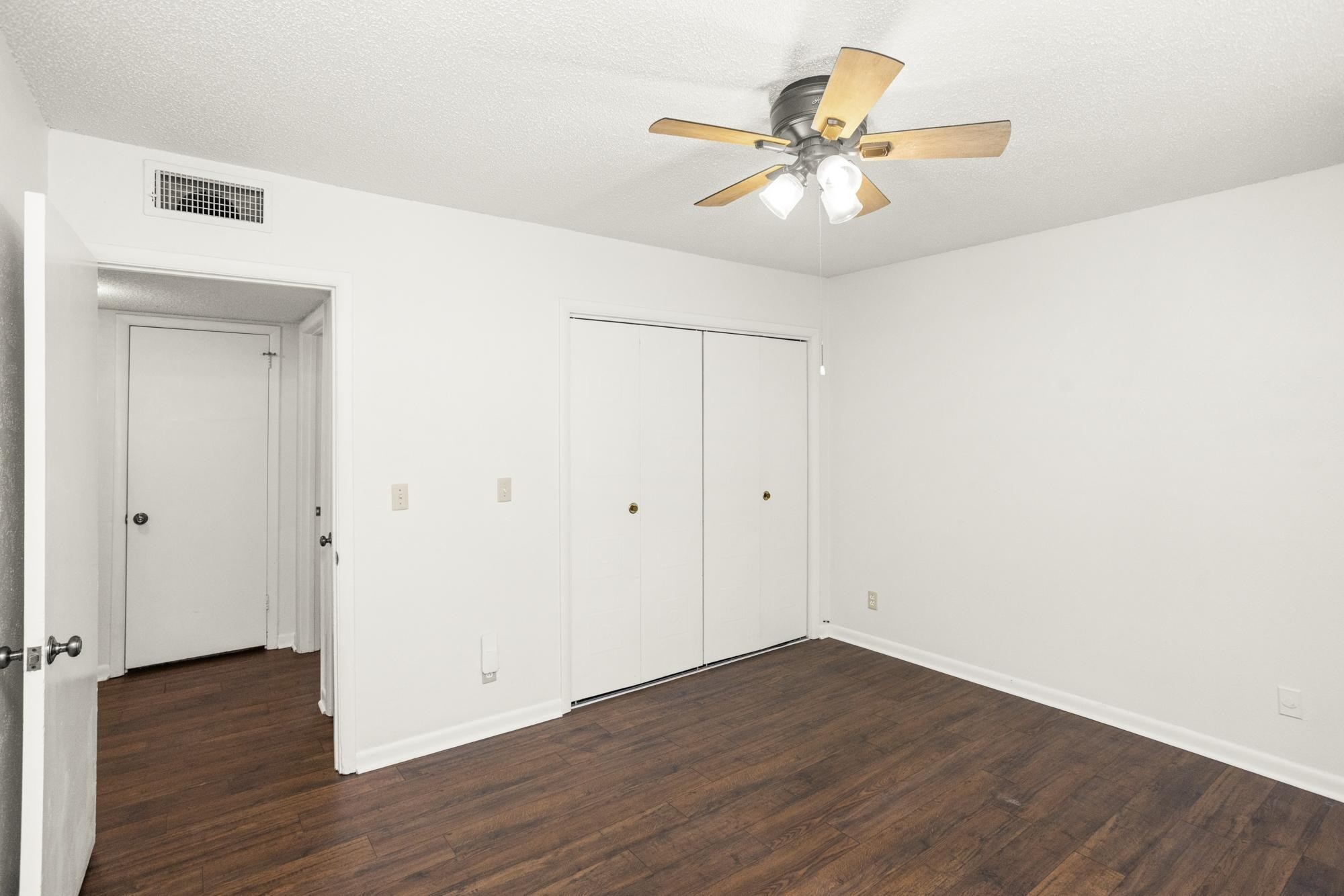 21 Vaughns Gap Road, Unit 16 Nashville, TN 37205 - Photo 20 of 34 a view of an empty room with wooden floor