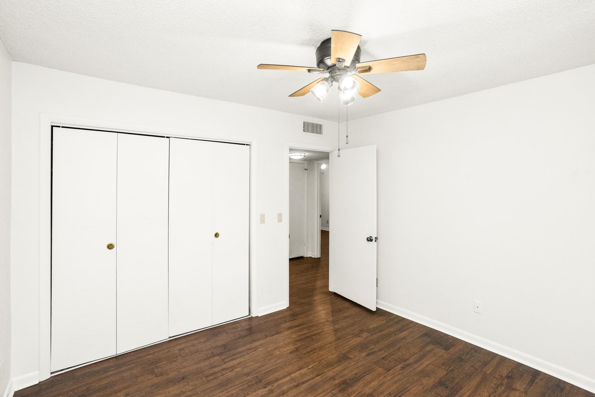 21 Vaughns Gap Road, Unit 16 Nashville, TN 37205 - Photo 25 of 34 a view of a room with wooden floor closet and fan