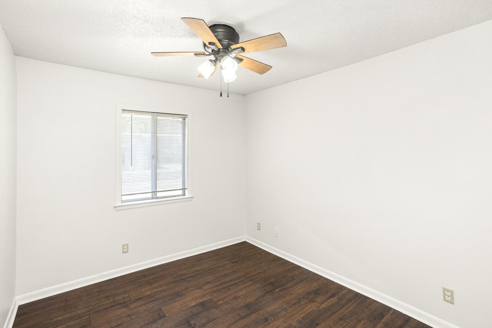 21 Vaughns Gap Road, Unit 16 Nashville, TN 37205 - Photo 28 of 34 an empty room with wooden floor fan and windows