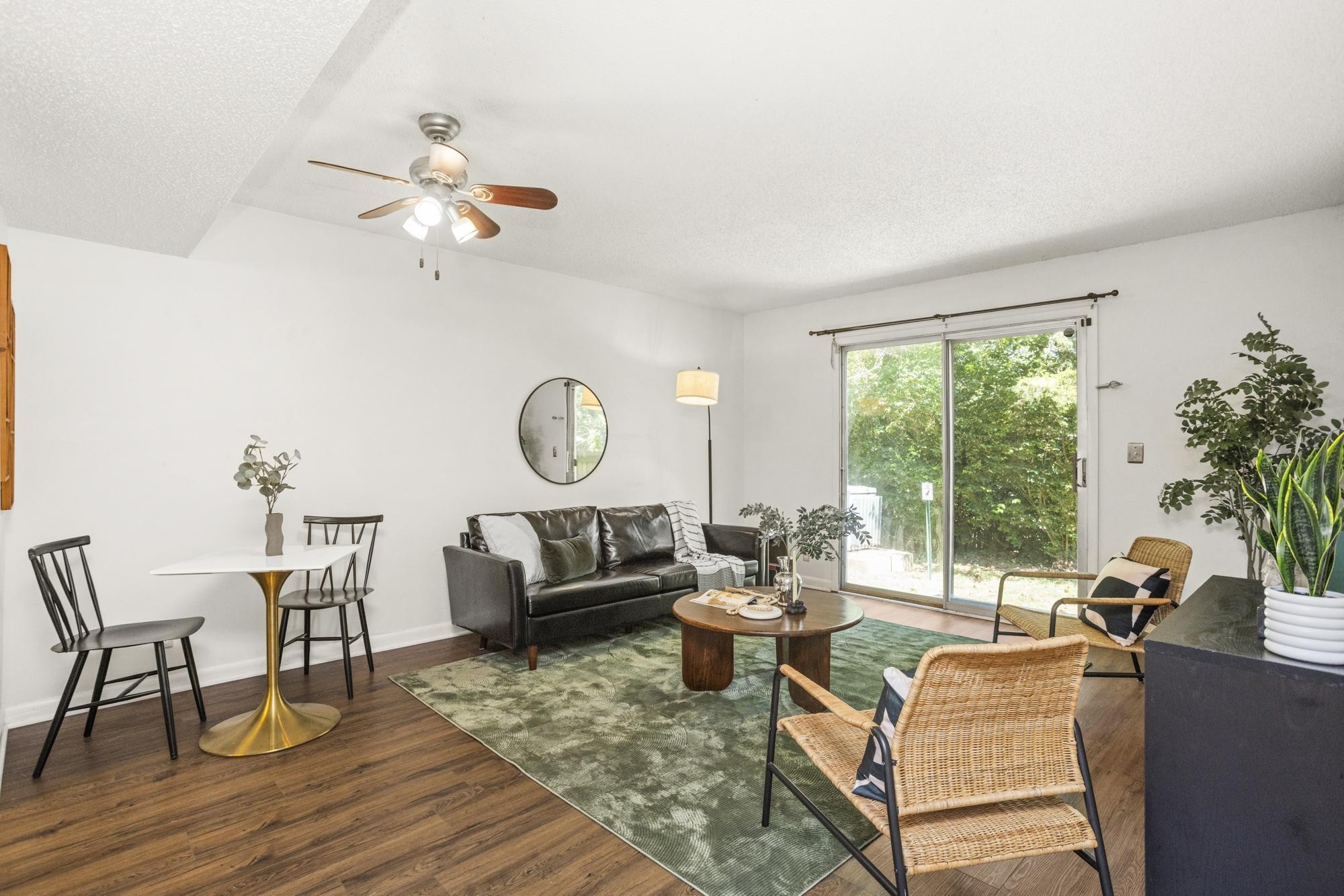 21 Vaughns Gap Road, Unit 16 Nashville, TN 37205 - Photo 5 of 34 a living room with furniture a rug potted plant and a large window
