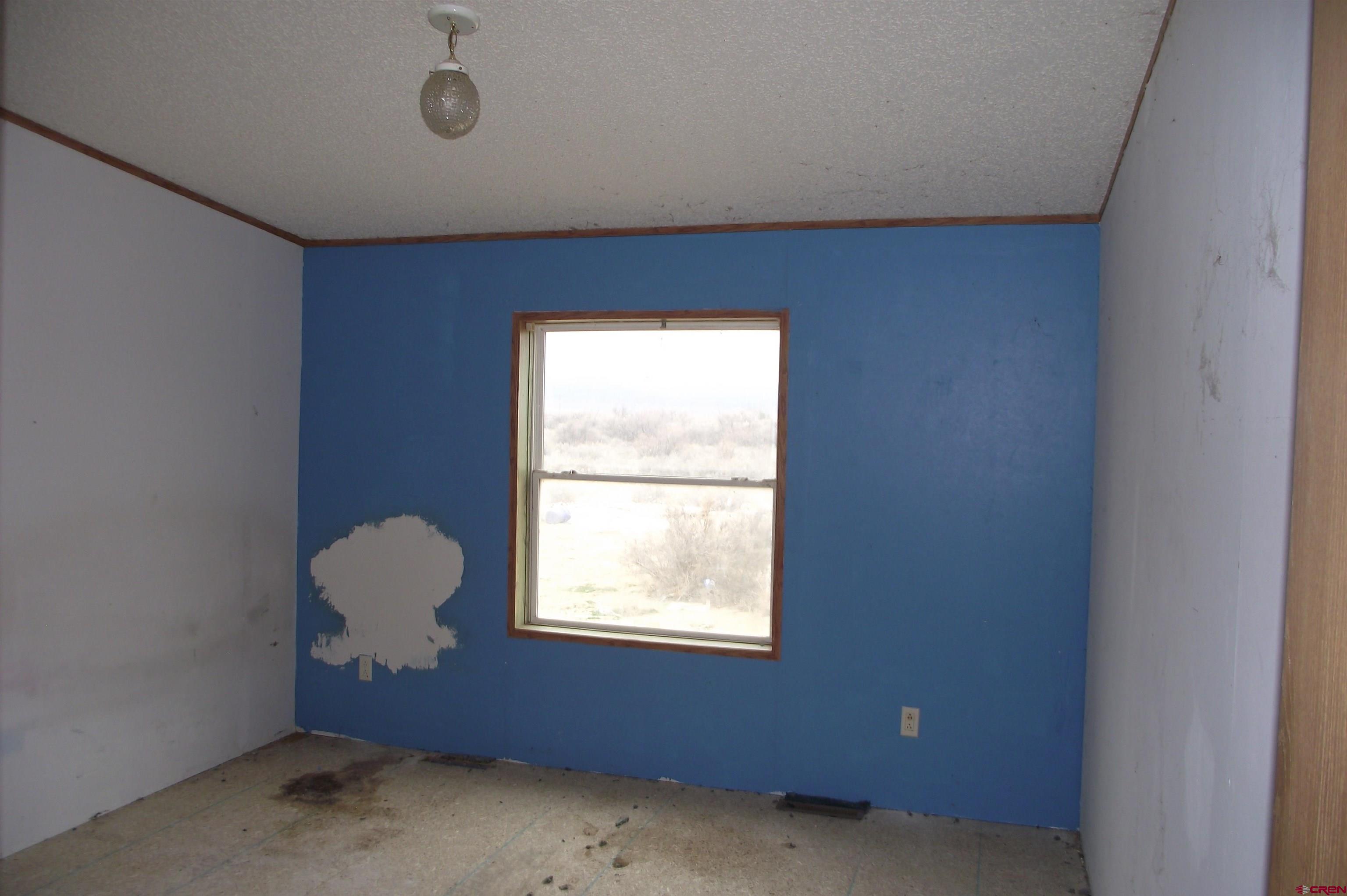 3747 2000th Road Delta, CO 81416 - Photo 20 of 24 an empty room with windows