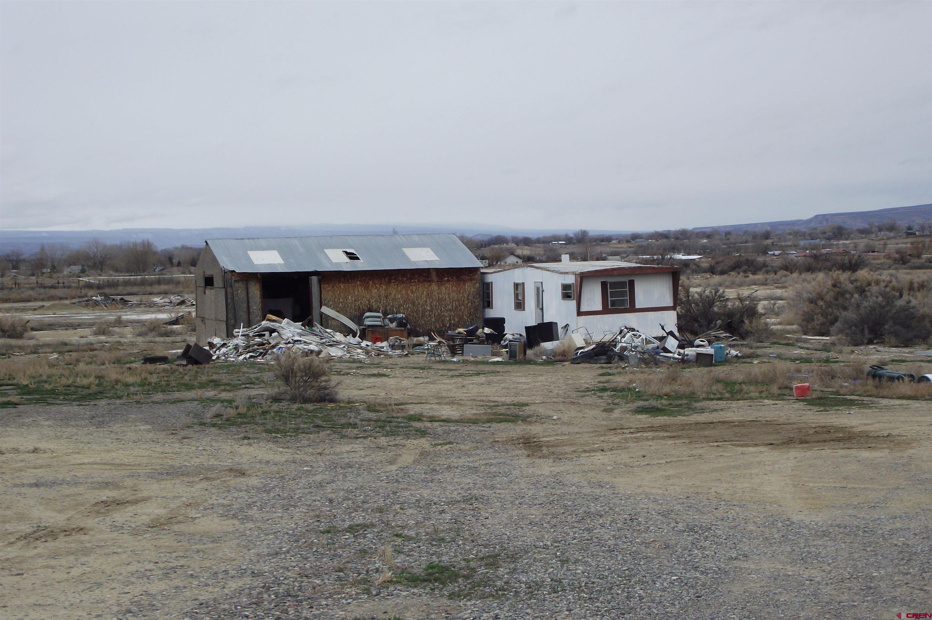 3747 2000th Road Delta, CO 81416 - Photo 2 of 24 a view of a house with a yard