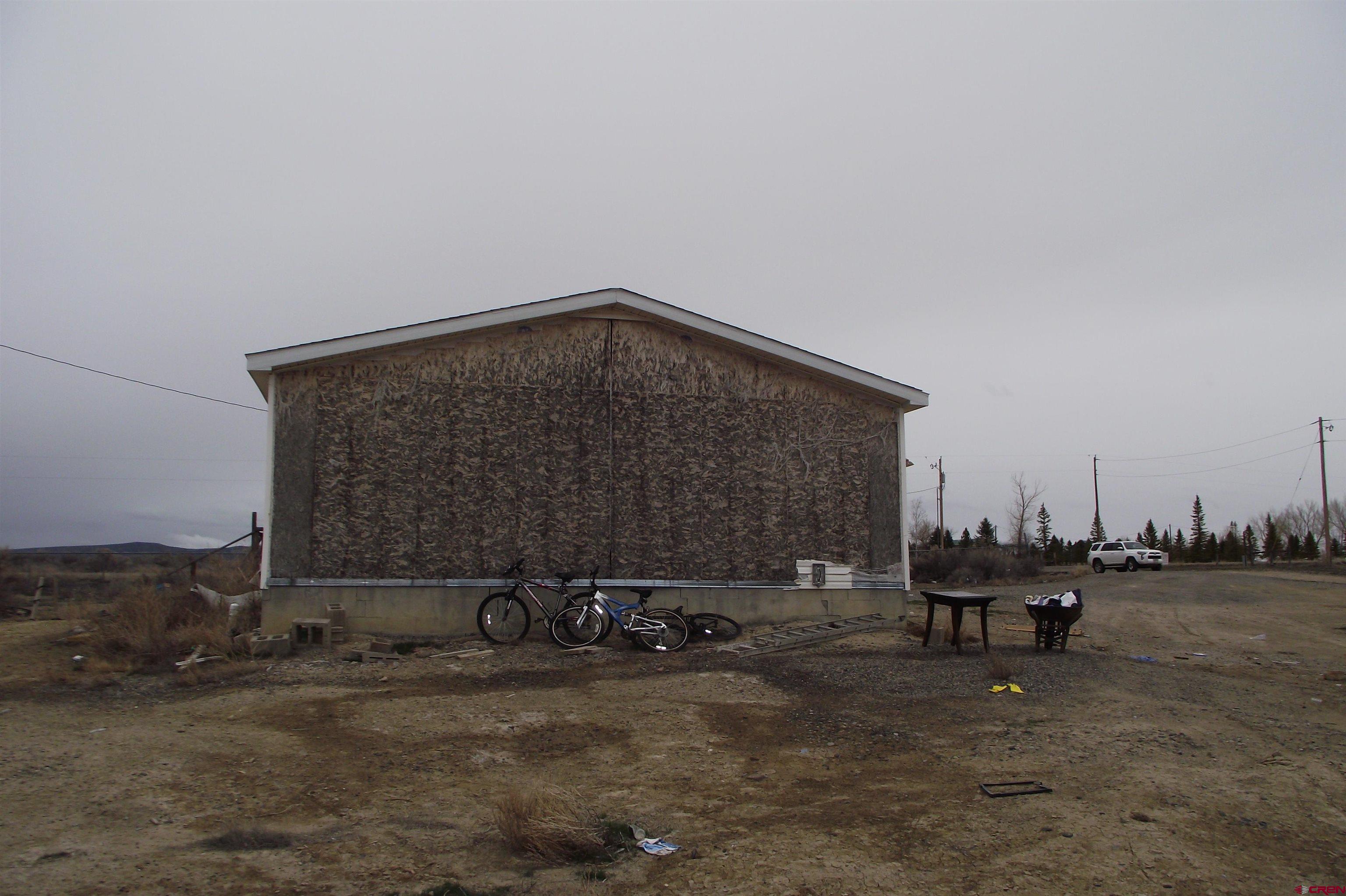 3747 2000th Road Delta, CO 81416 - Photo 7 of 24 a backyard of a house with table and chairs