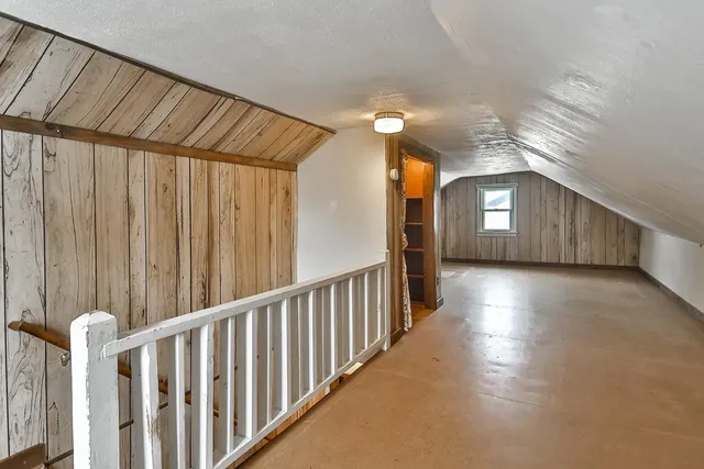 a view of a porch with wooden floor and stairs