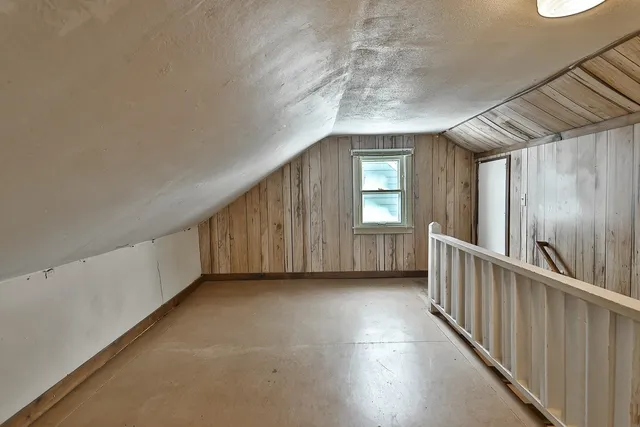 a view of a hallway with windows