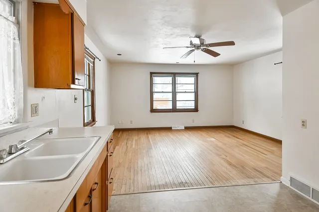 a view of a kitchen sink and a window