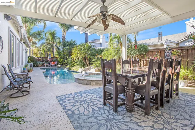 a view of a dining room with furniture and chandelier