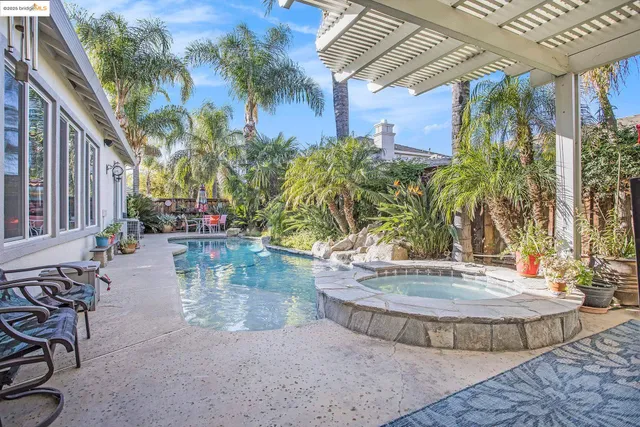 a view of a swimming pool with a patio