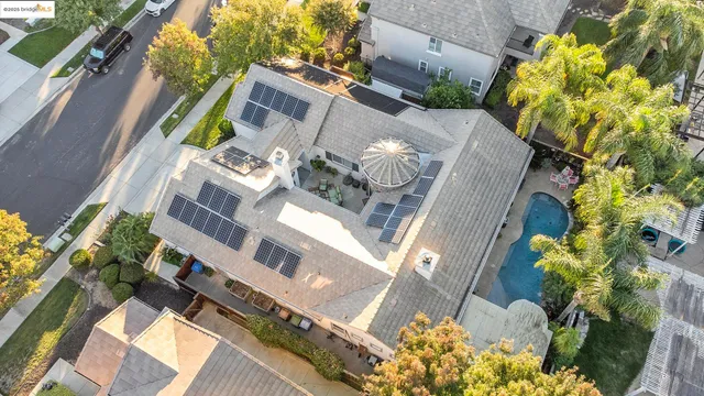 a aerial view of a house with a yard and garden