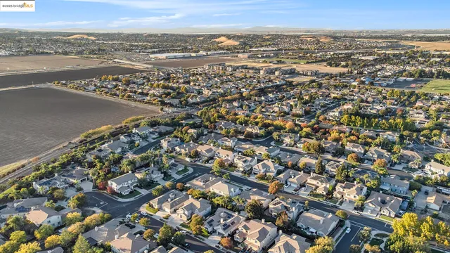 an aerial view of residential building and ocean view