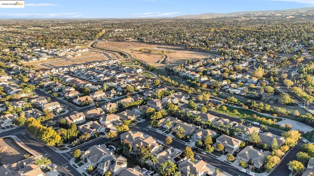 an aerial view of residential building and ocean view