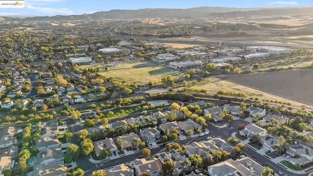 an aerial view of residential building and ocean view
